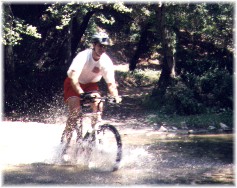 a typical mountain biker trashes creek habitat